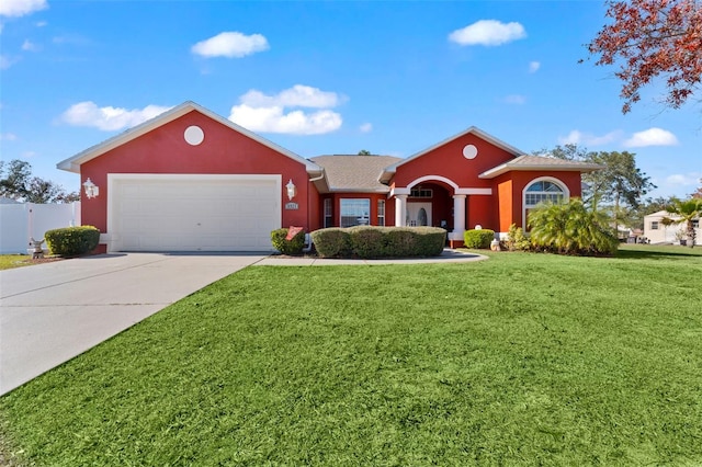 ranch-style house featuring a garage and a front yard