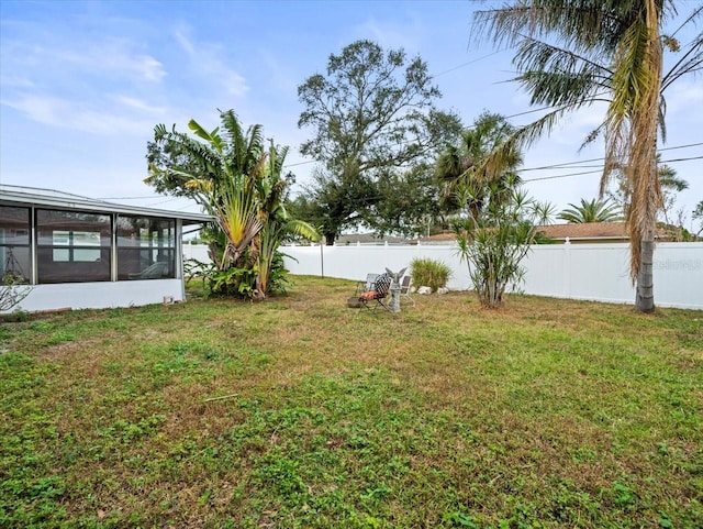 view of yard with a sunroom