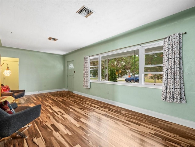 sitting room featuring hardwood / wood-style flooring