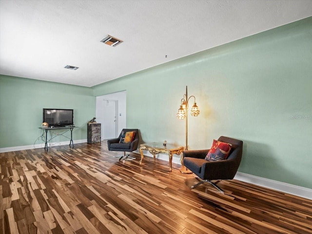 unfurnished room with wood-type flooring