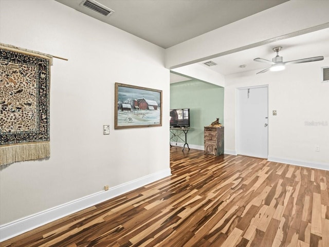 foyer featuring ceiling fan and wood-type flooring