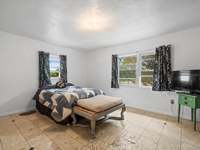 bedroom featuring a textured ceiling