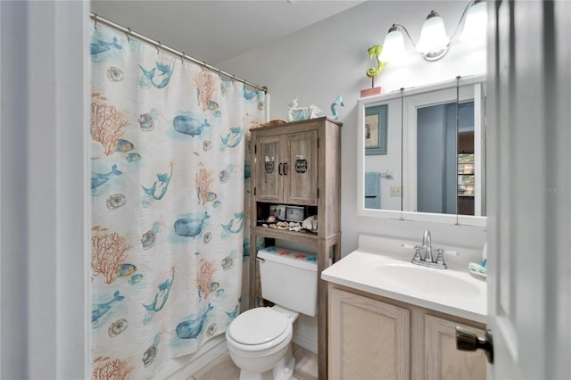 bathroom featuring toilet and vanity