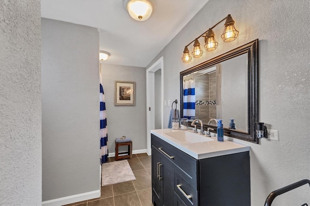 bathroom featuring vanity, a shower with curtain, and tile patterned flooring