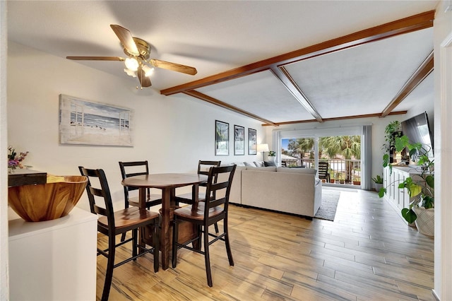 dining area with beam ceiling, light hardwood / wood-style flooring, and ceiling fan