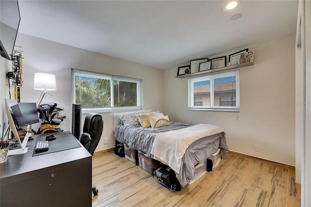 bedroom with light hardwood / wood-style floors