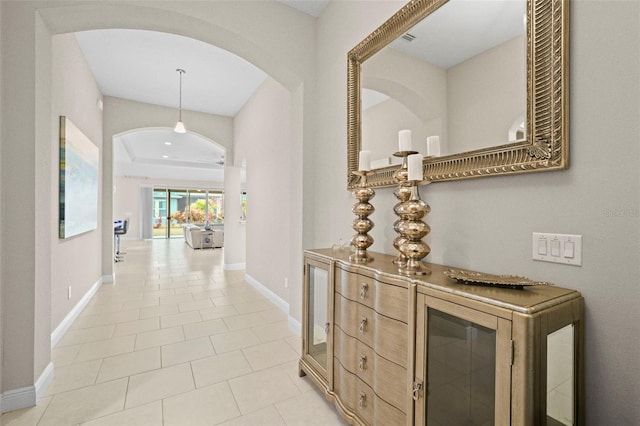 corridor with light tile patterned flooring