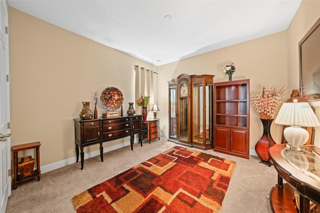 living area featuring light colored carpet