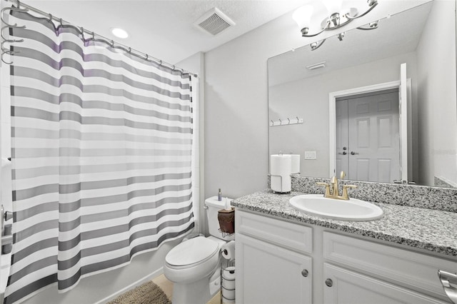 full bathroom with vanity, shower / bath combination with curtain, a textured ceiling, and toilet