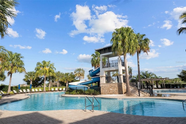 view of pool with a water slide