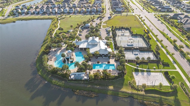 birds eye view of property with a water view