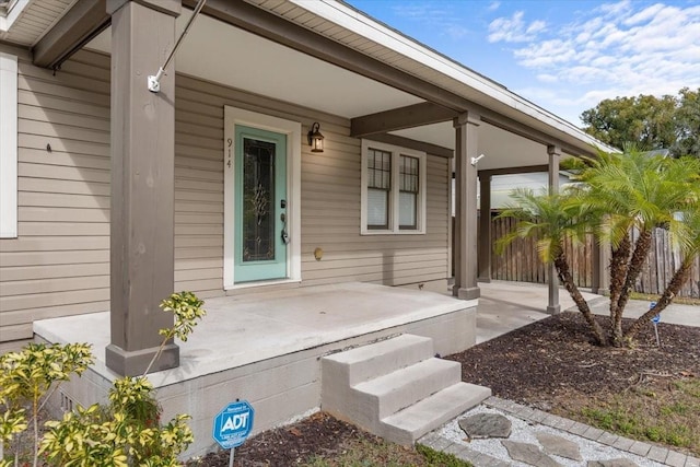 doorway to property with covered porch