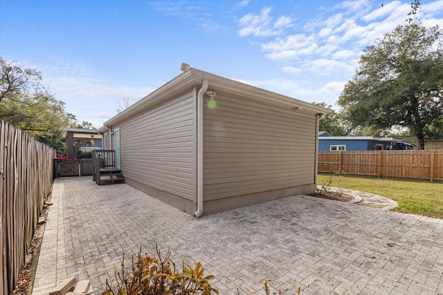 view of property exterior featuring a patio