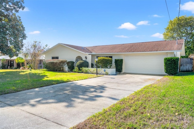 ranch-style house featuring a garage and a front yard