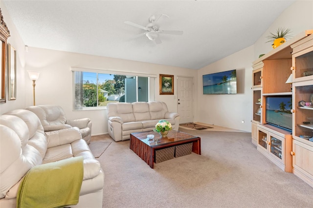 living room featuring light carpet, ceiling fan, and lofted ceiling