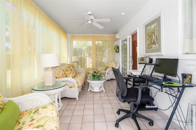 tiled office space with ceiling fan and an AC wall unit