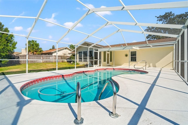 view of pool with a lanai, a yard, and a patio