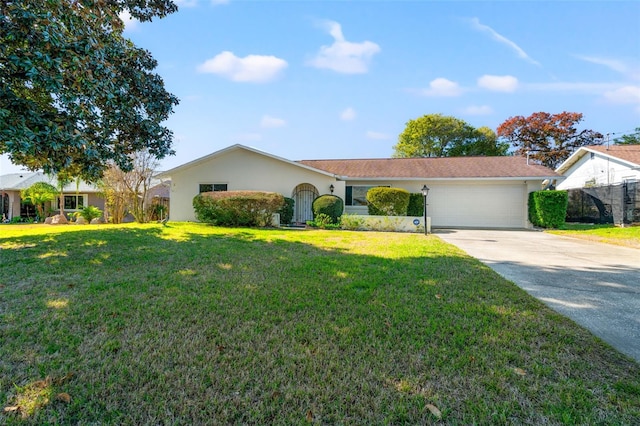 single story home with a garage and a front lawn