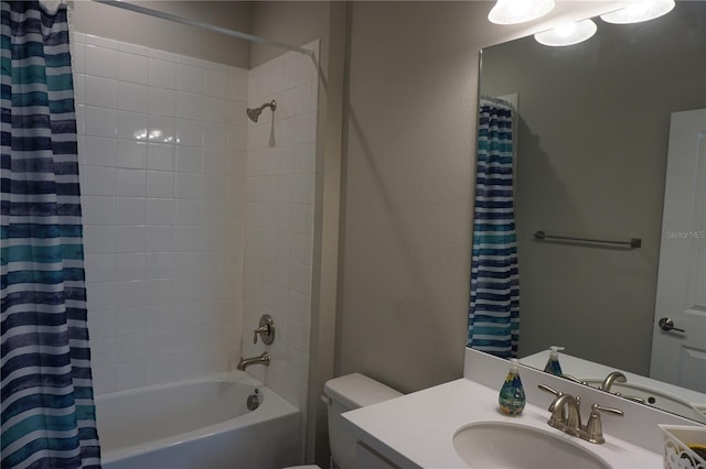 full bathroom with shower / tub combo, vanity, and toilet