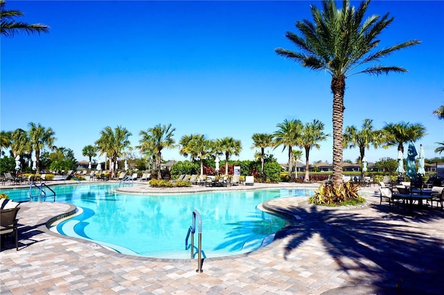 community pool with a patio