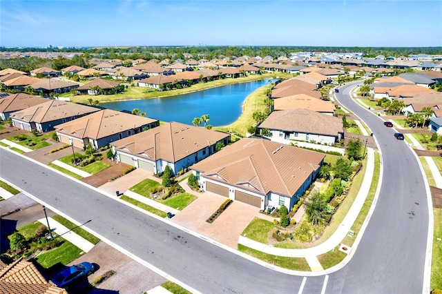 aerial view with a residential view and a water view