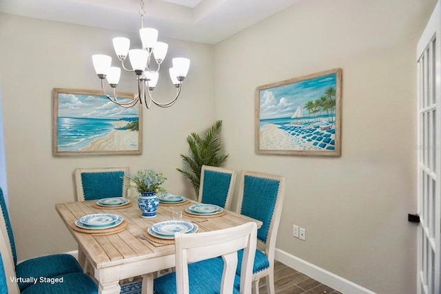 5426 Rushmere Ct, Palmetto, FL 34221 - dining space with a chandelier and wood finished floors