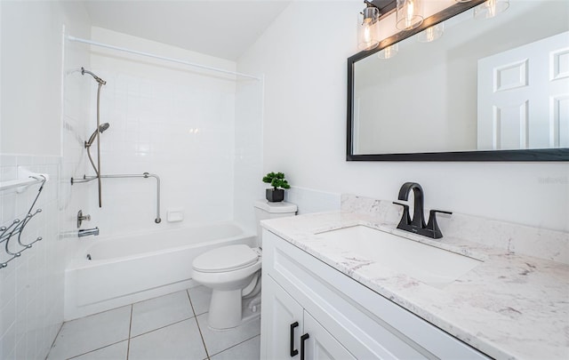 full bathroom with vanity, tiled shower / bath, tile patterned floors, and toilet