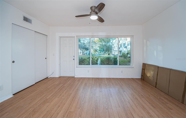 unfurnished bedroom featuring light hardwood / wood-style flooring and ceiling fan