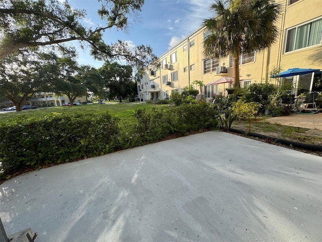 2258 World Parkway Blvd W Unit 8, Clearwater, FL 33763 - view of home's community featuring a patio area and a residential view
