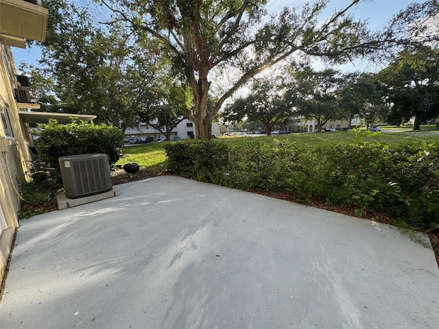2258 World Parkway Blvd W Unit 8, Clearwater, FL 33763 - view of patio with central AC unit