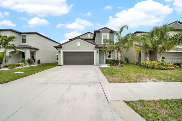 view of front of property with a front yard and a garage