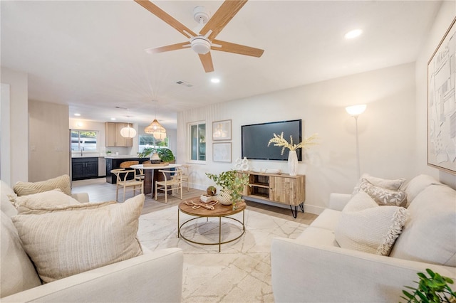 living room with ceiling fan