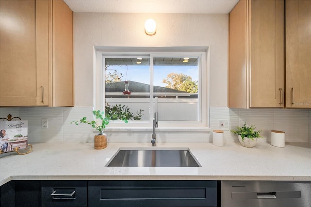 kitchen featuring sink, light brown cabinets, dishwasher, and tasteful backsplash