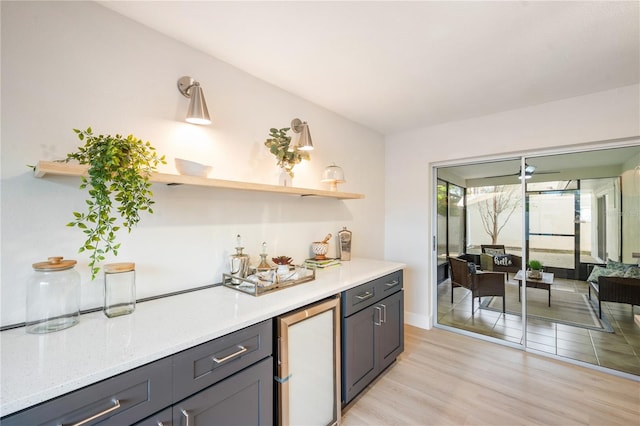 kitchen featuring refrigerator and light hardwood / wood-style floors