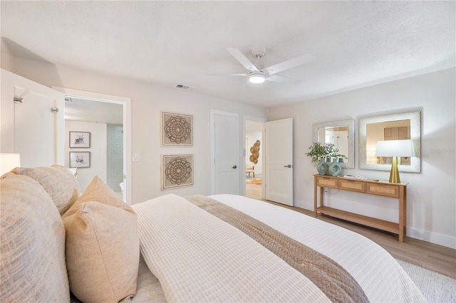 bedroom with ceiling fan and light hardwood / wood-style flooring