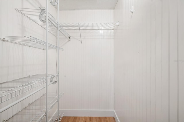 walk in closet featuring hardwood / wood-style floors