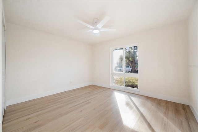 spare room with light hardwood / wood-style floors and ceiling fan