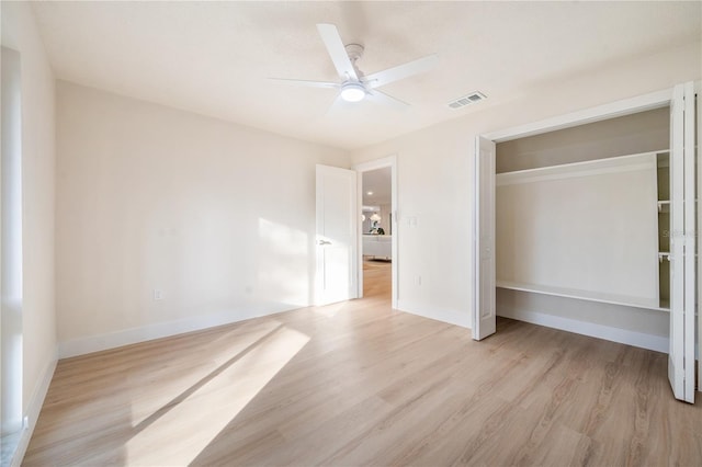 unfurnished bedroom with ceiling fan, a closet, and light hardwood / wood-style floors