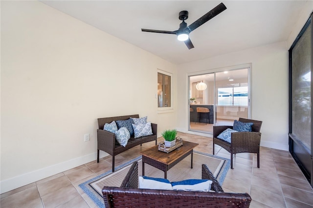 interior space with ceiling fan