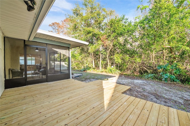 wooden terrace with a sunroom