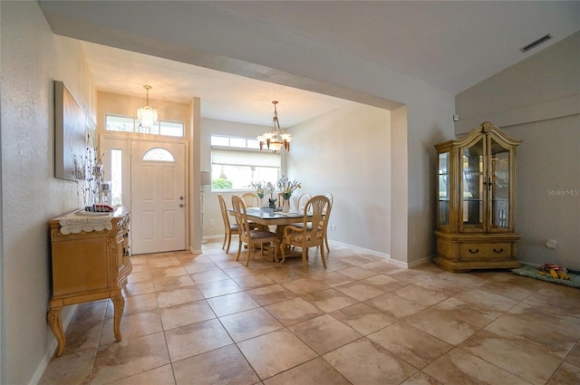 dining space featuring a chandelier