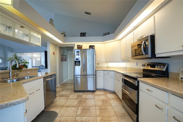 kitchen featuring sink, stainless steel appliances, and white cabinetry