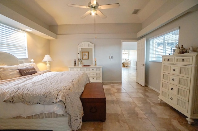 tiled bedroom with ceiling fan