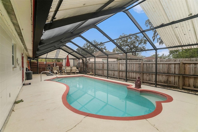 view of pool with a lanai and a patio area