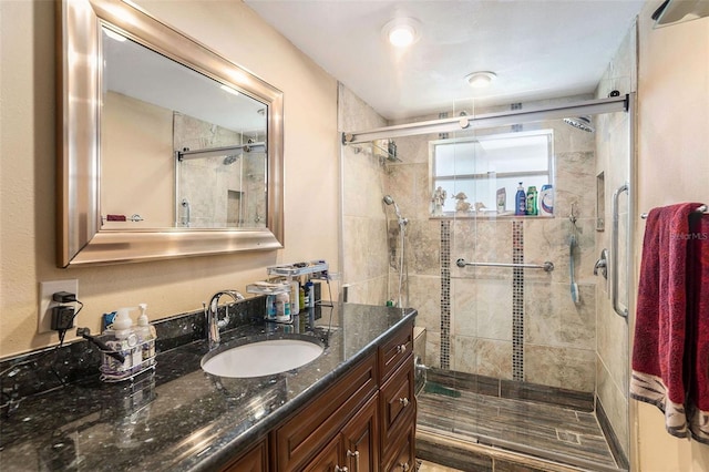 bathroom with vanity and an enclosed shower