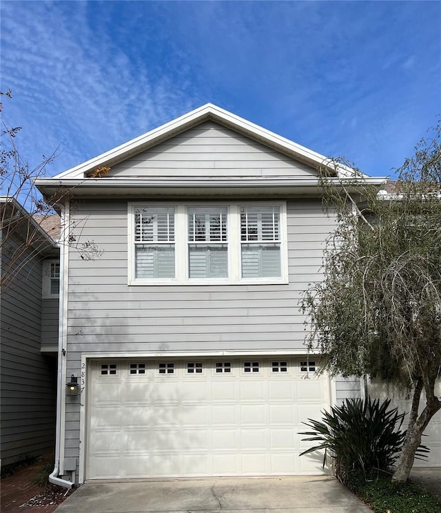 view of side of property featuring a garage