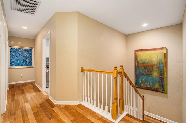 corridor featuring hardwood / wood-style floors