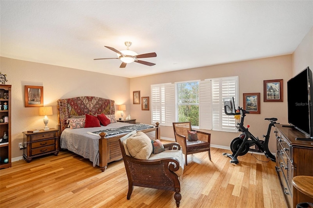 bedroom with ceiling fan and light wood-type flooring