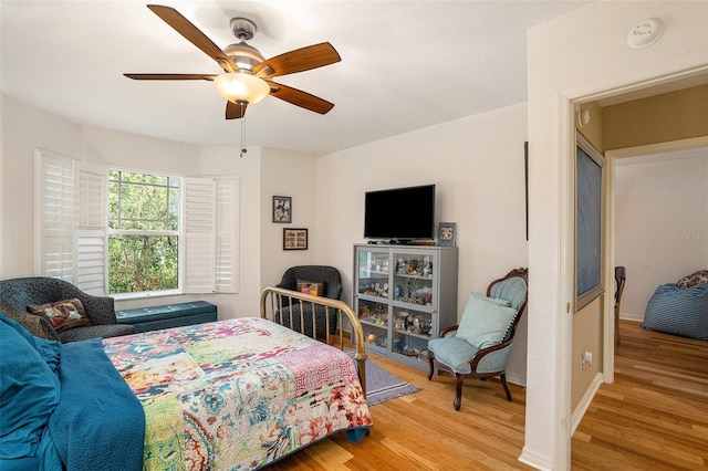 bedroom featuring light wood-type flooring and ceiling fan