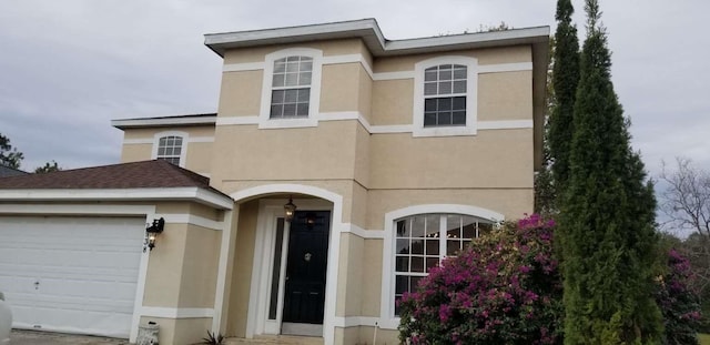 view of front of property with a garage